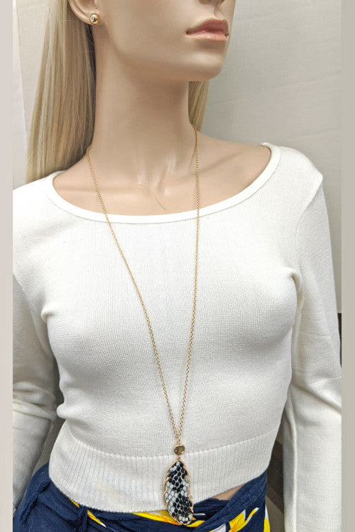 Gold Necklace With Animal Print Design and Earrings